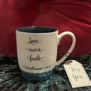 Love Never Fails Coffee Mug